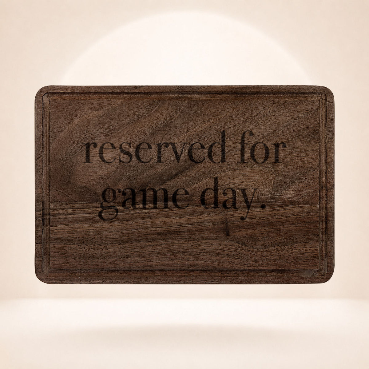 Reserved for Kickoff engraved walnut cutting board by The Sideline Shoppe