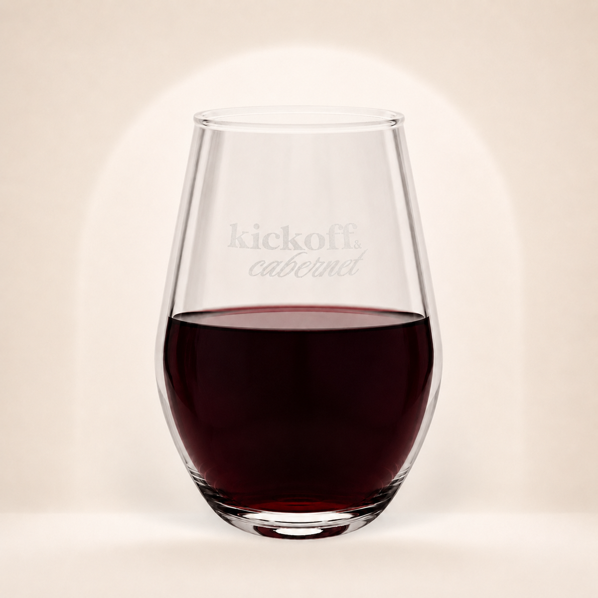 Kickoff & Cabernet engraved 11.5 oz stemless wine glass with red wine