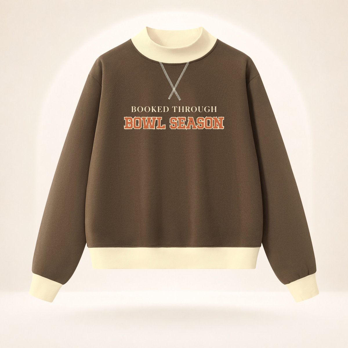 Booked Through Bowl Season women’s mock-neck sweatshirt in brown and apricot, front view