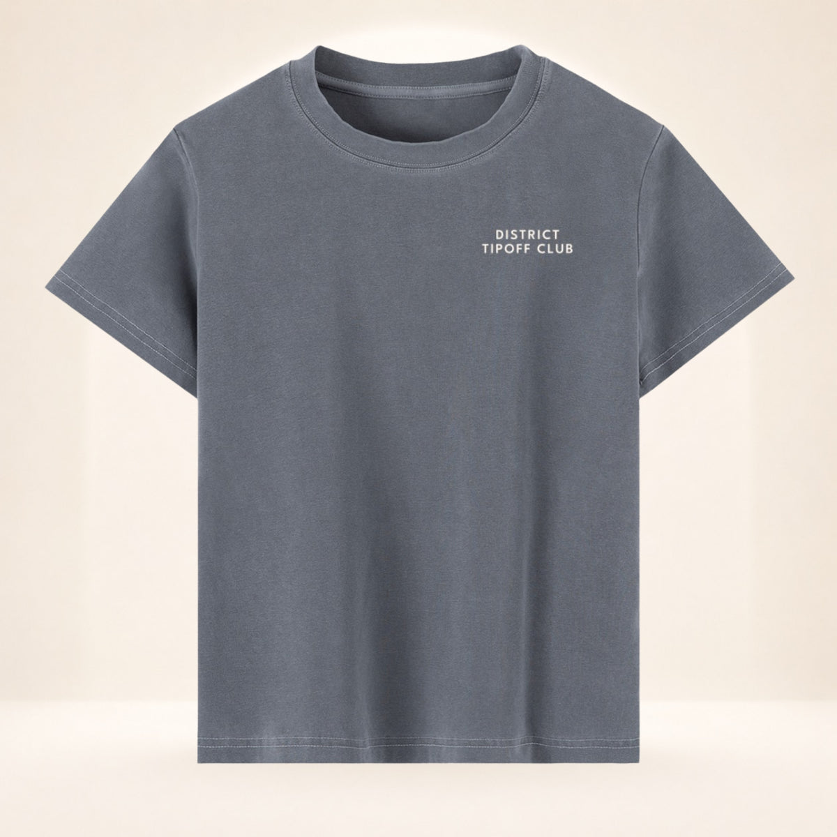 Front view of District Tipoff Club vintage wash women's basketball tee with small left-chest District Tipoff Club mark.