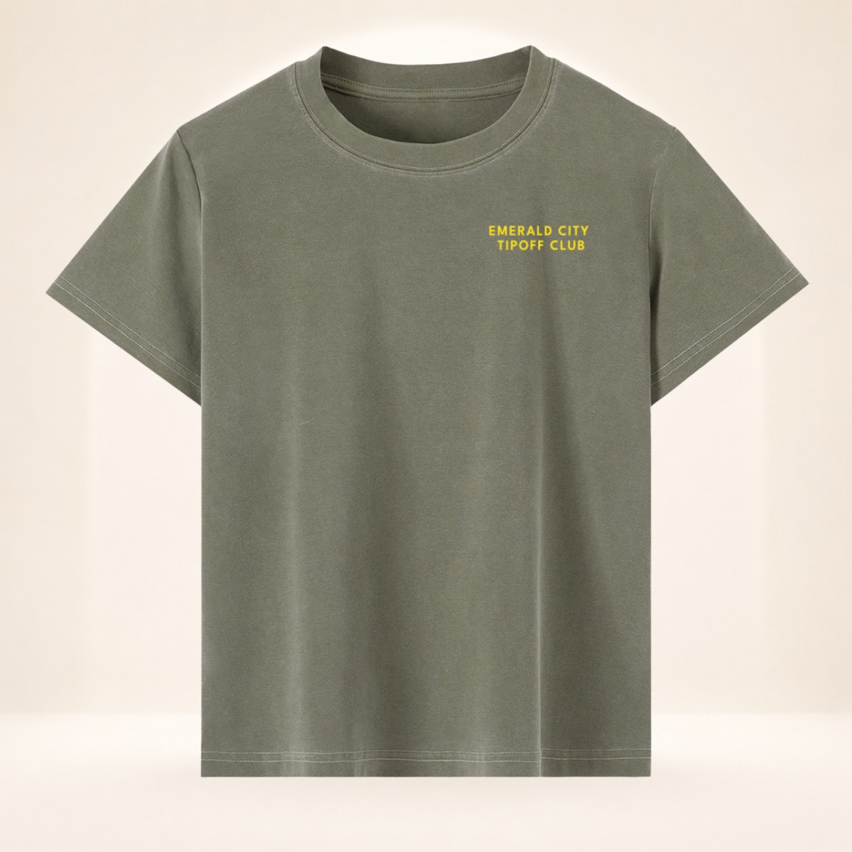 Front view of Emerald City Tipoff Club vintage wash women's basketball tee with small left-chest Emerald City Tipoff Club mark.