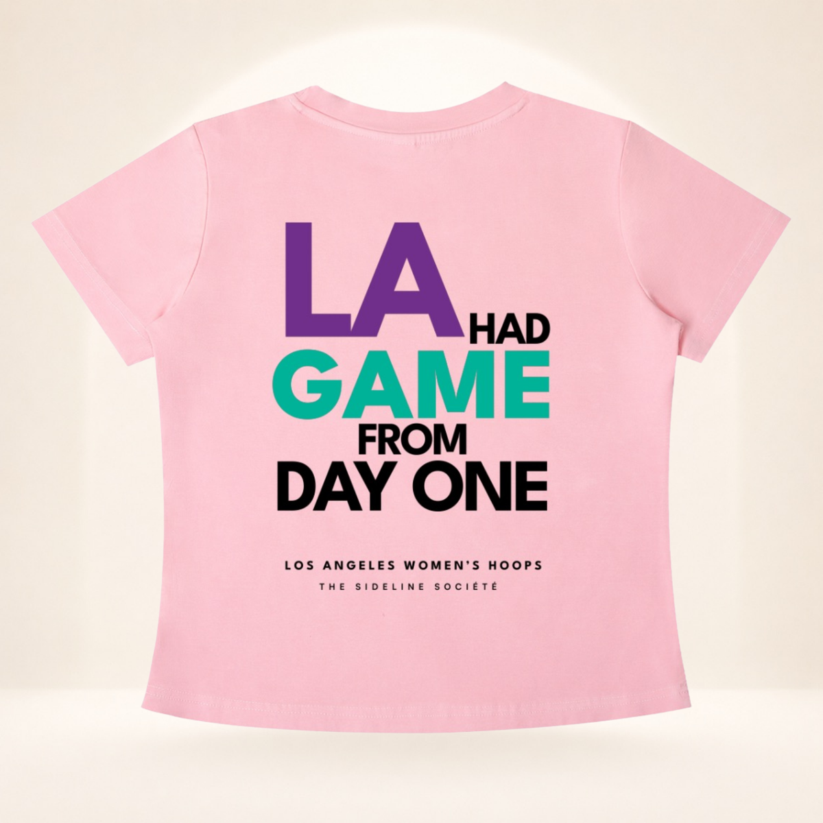 Flat back view of LA Tipoff Club vintage wash women's basketball tee with LA Had Game From Day One graphic.