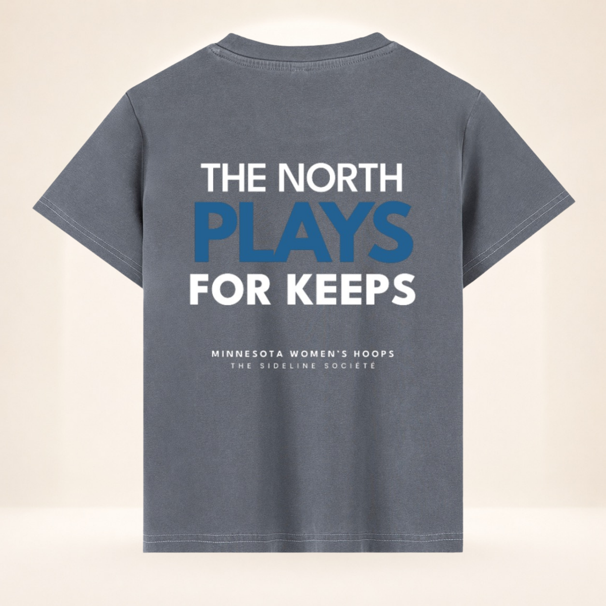 Back view of North Star Tipoff Club vintage wash women's basketball tee with The North Plays for Keeps graphic.