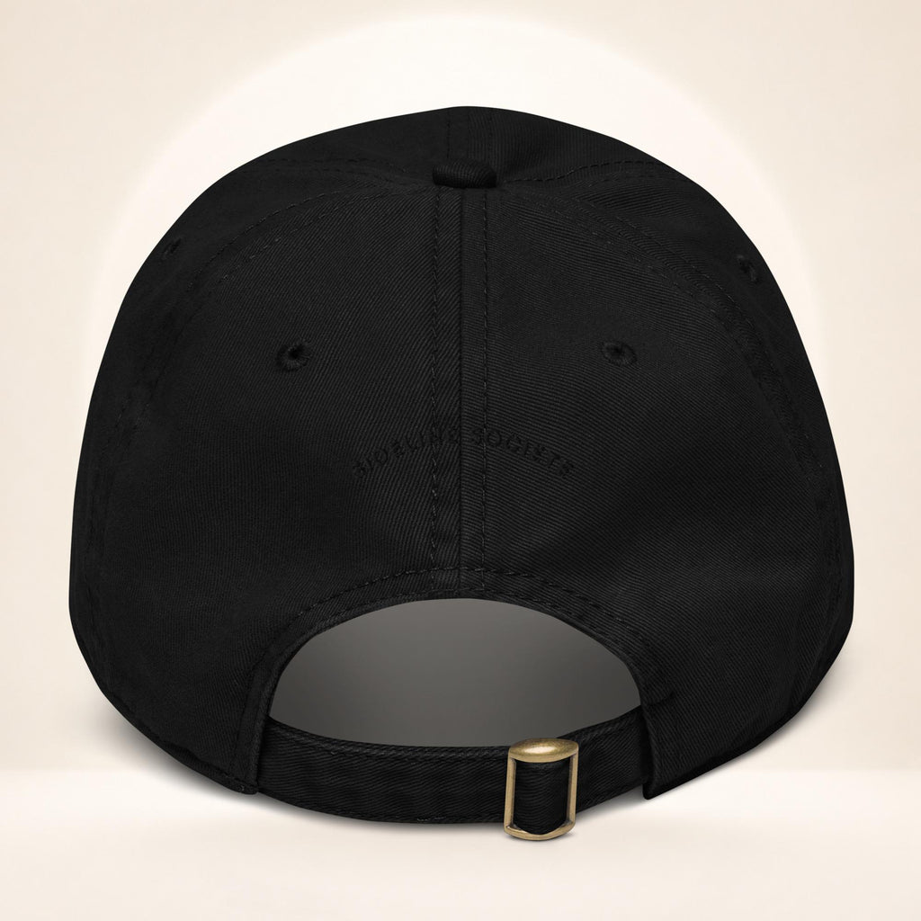 Back view of the Black garment-washed baseball cap with adjustable fabric strap