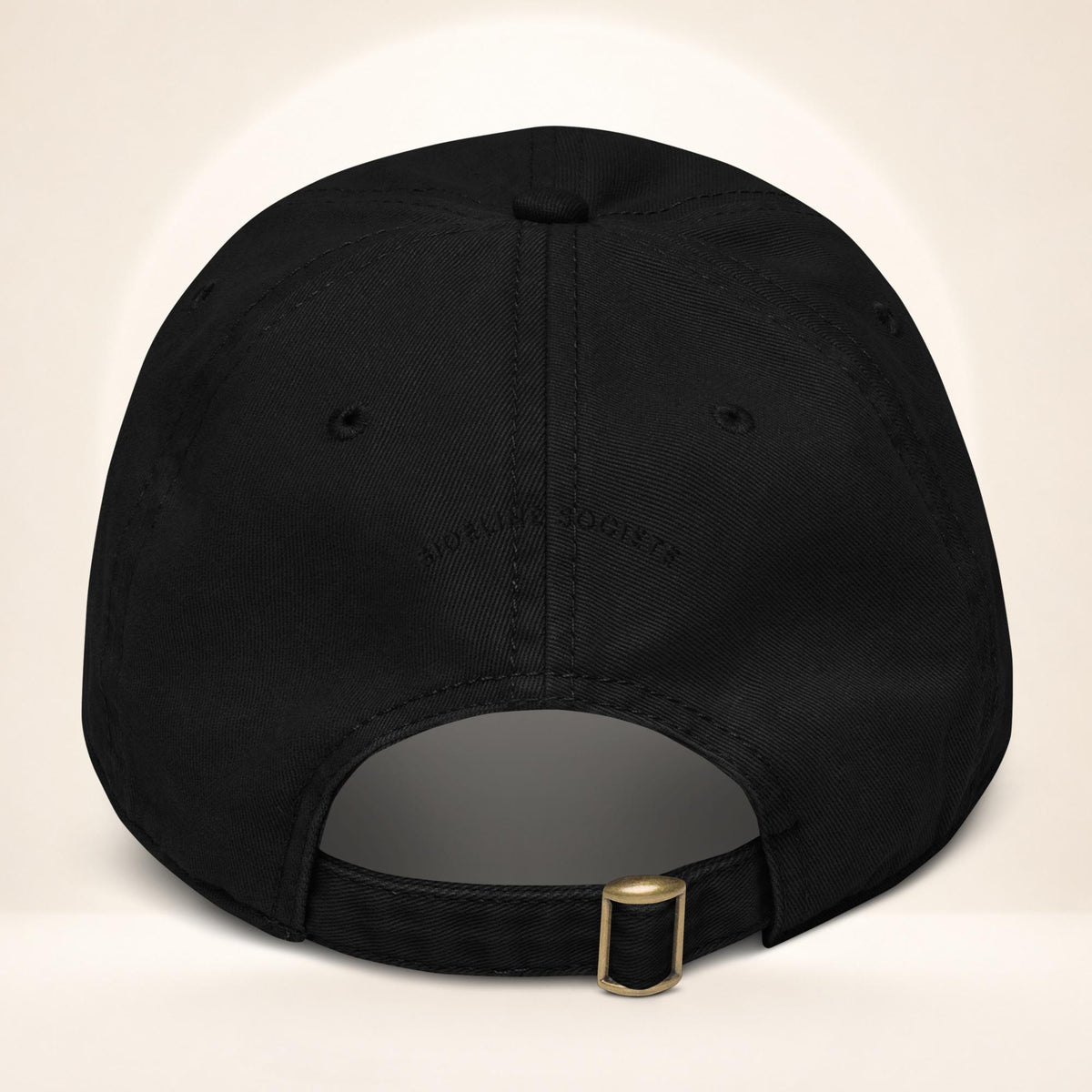 Back view of the Black garment-washed baseball cap with adjustable fabric strap