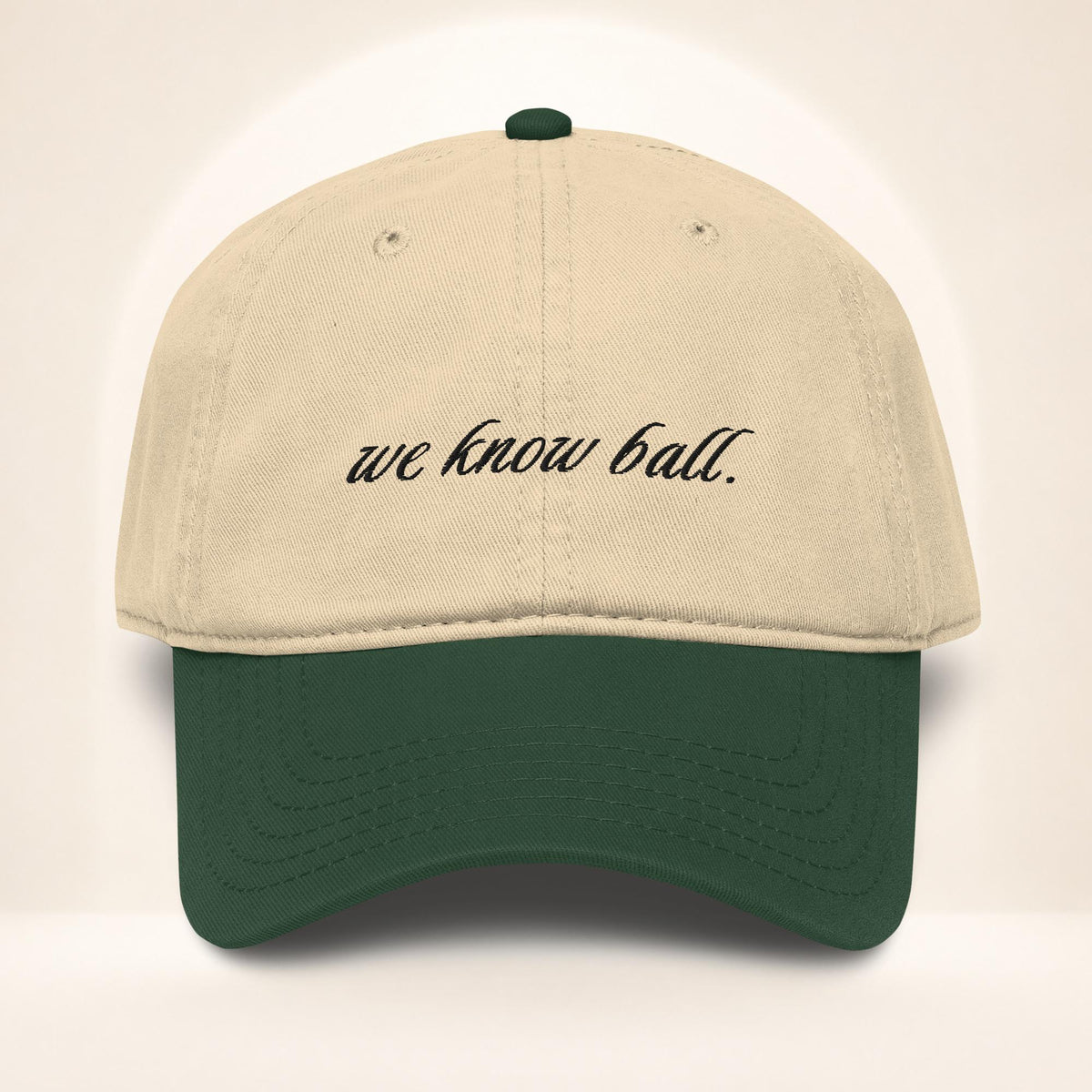 Front view of the We Know Ball Script Dark Green and Khaki garment-washed baseball cap