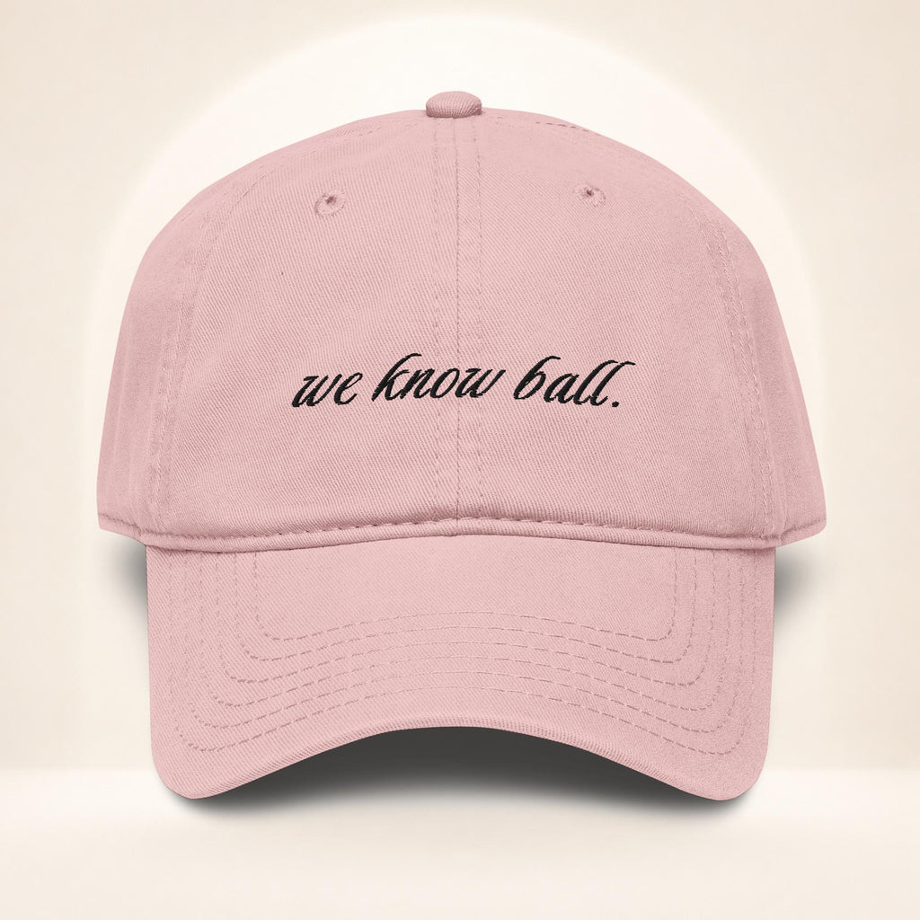 Front view of the We Know Ball Script Dusty Rose garment-washed baseball cap