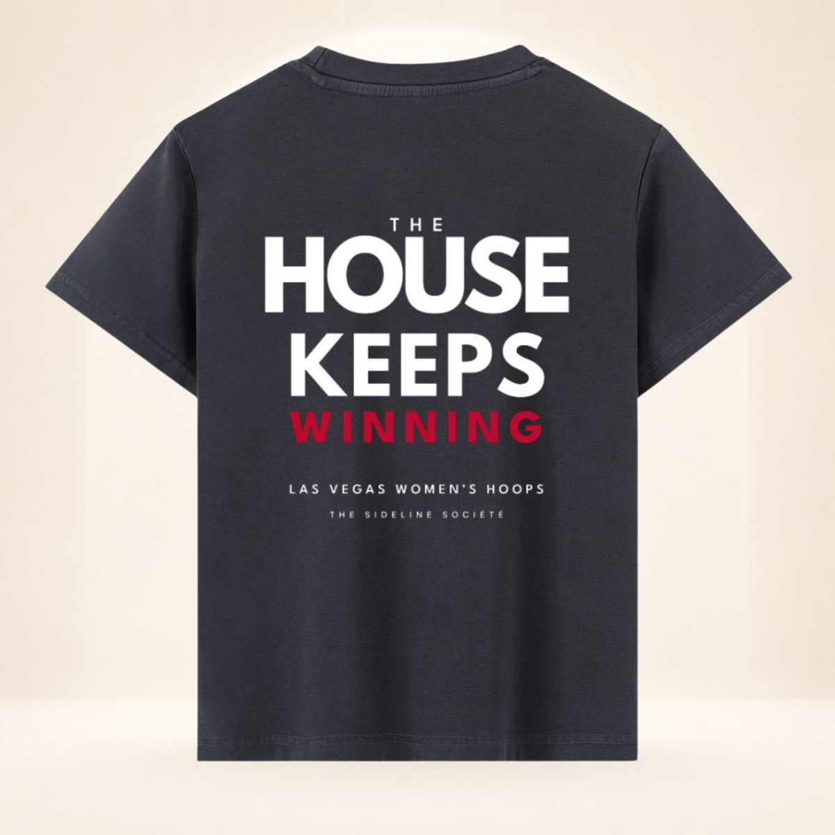 Back view of Vegas Tipoff Club vintage wash women's basketball tee with The House Keeps Winning graphic.