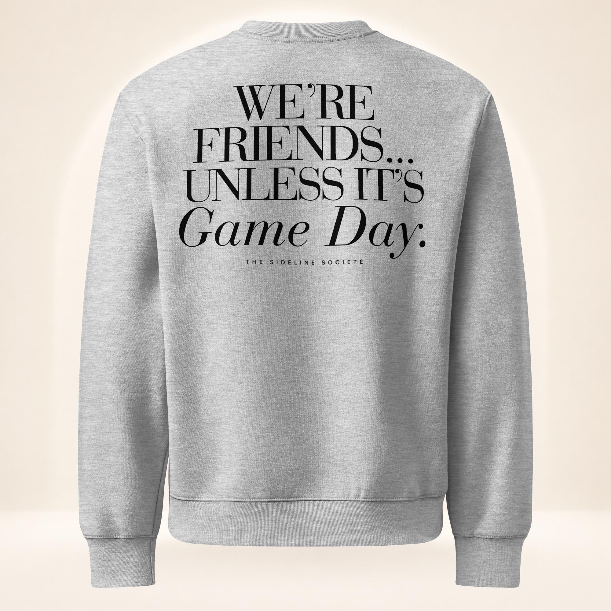 Back of athletic heather gray oversized heavyweight sweatshirt featuring oversized “We’re Friends…Unless It’s Game Day.™” graphic with The Sideline Société branding.
