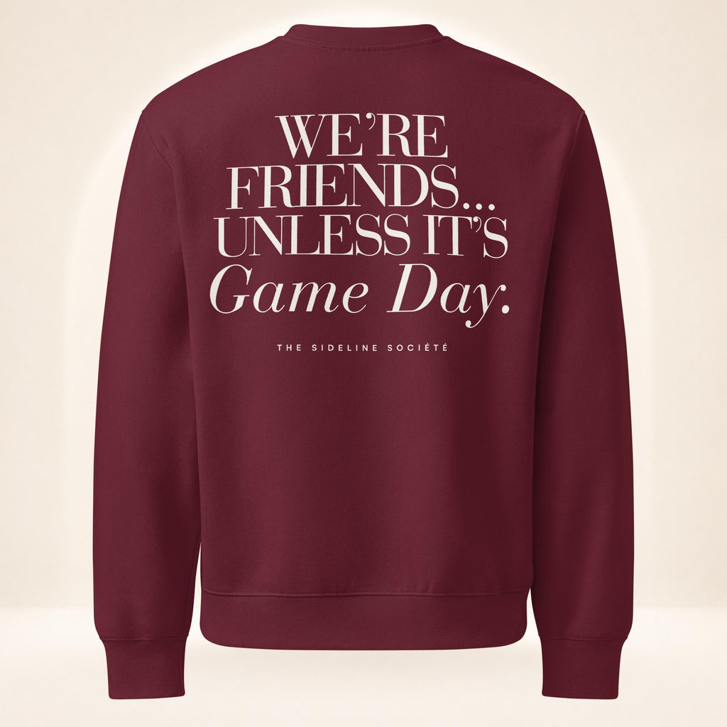 Back of maroon oversized heavyweight sweatshirt featuring oversized “We’re Friends…Unless It’s Game Day.™” graphic with The Sideline Société branding.