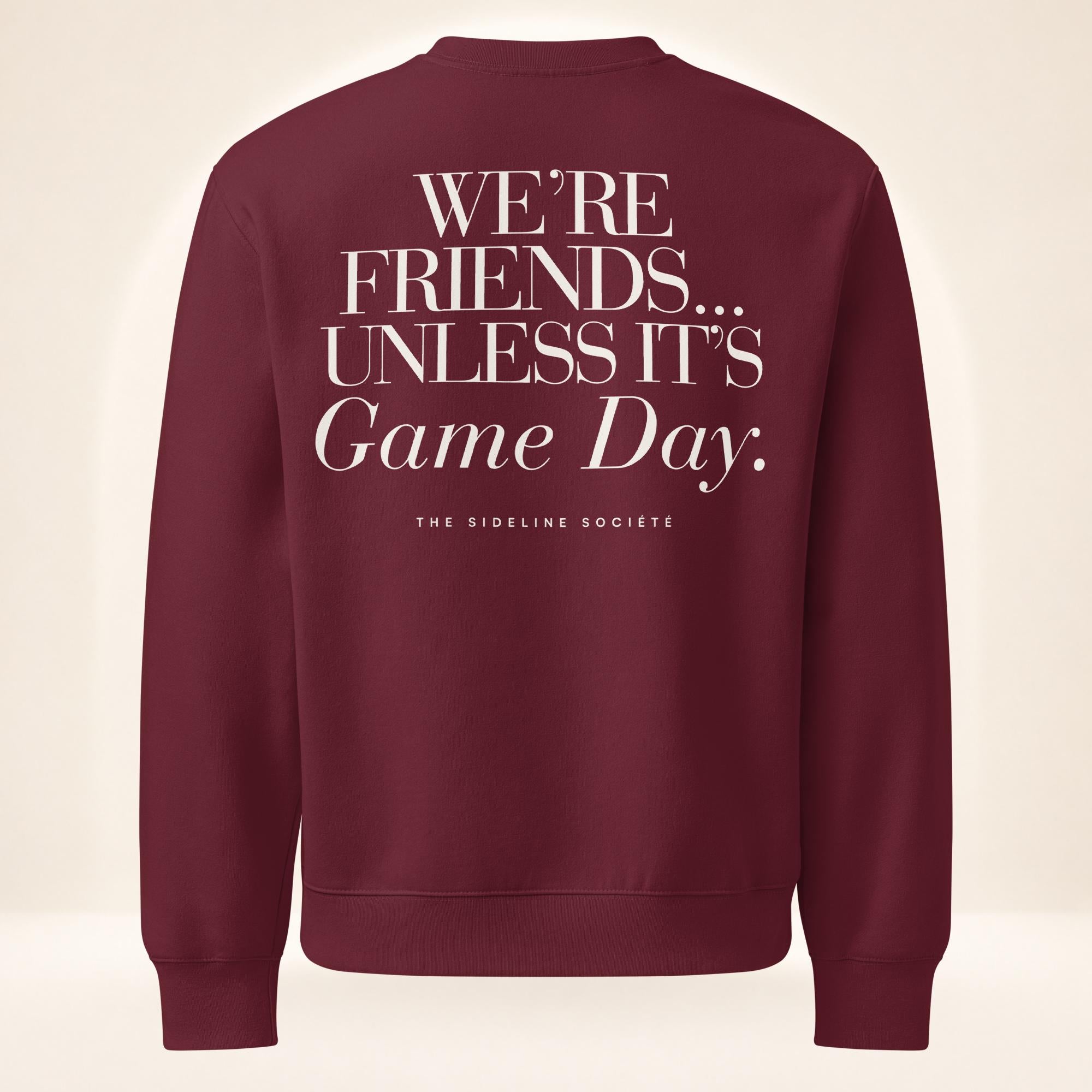 Back of maroon oversized heavyweight sweatshirt featuring oversized “We’re Friends…Unless It’s Game Day.™” graphic with The Sideline Société branding.